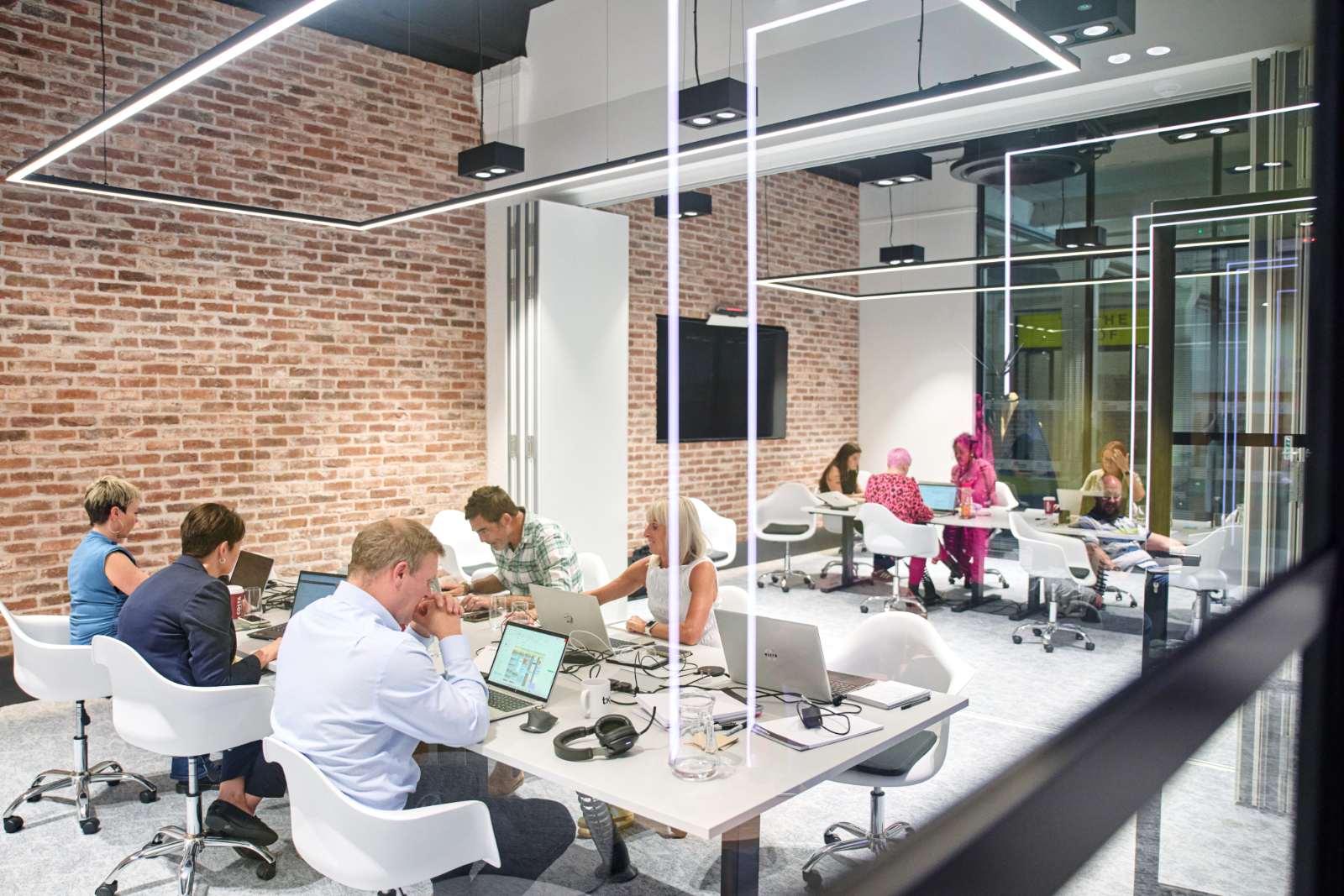 TXP staff work in modern office